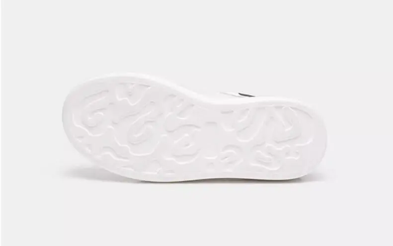 woman white sneakers